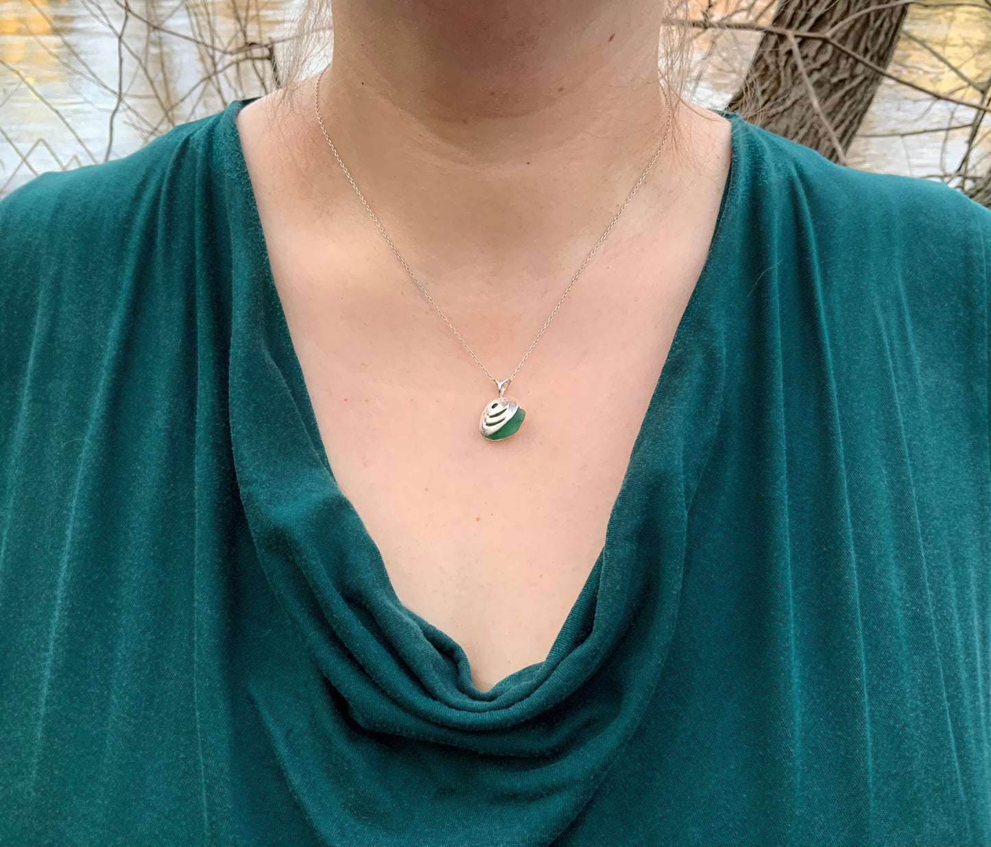 Handmade silver seashell necklace on woman model