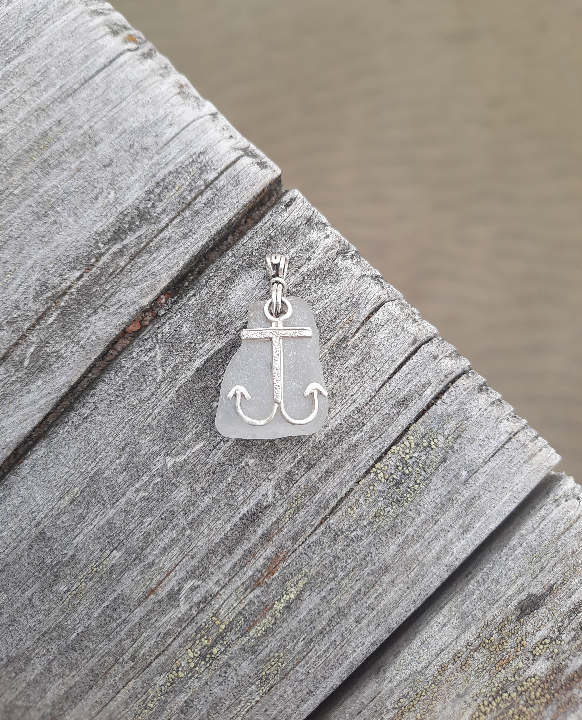 Handmade anchor pendant on pier