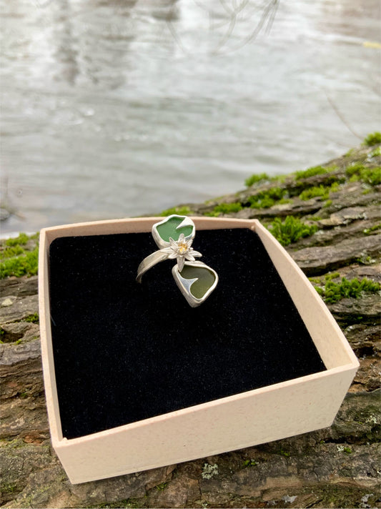Handmade Waterlily ring in jewelry box against water