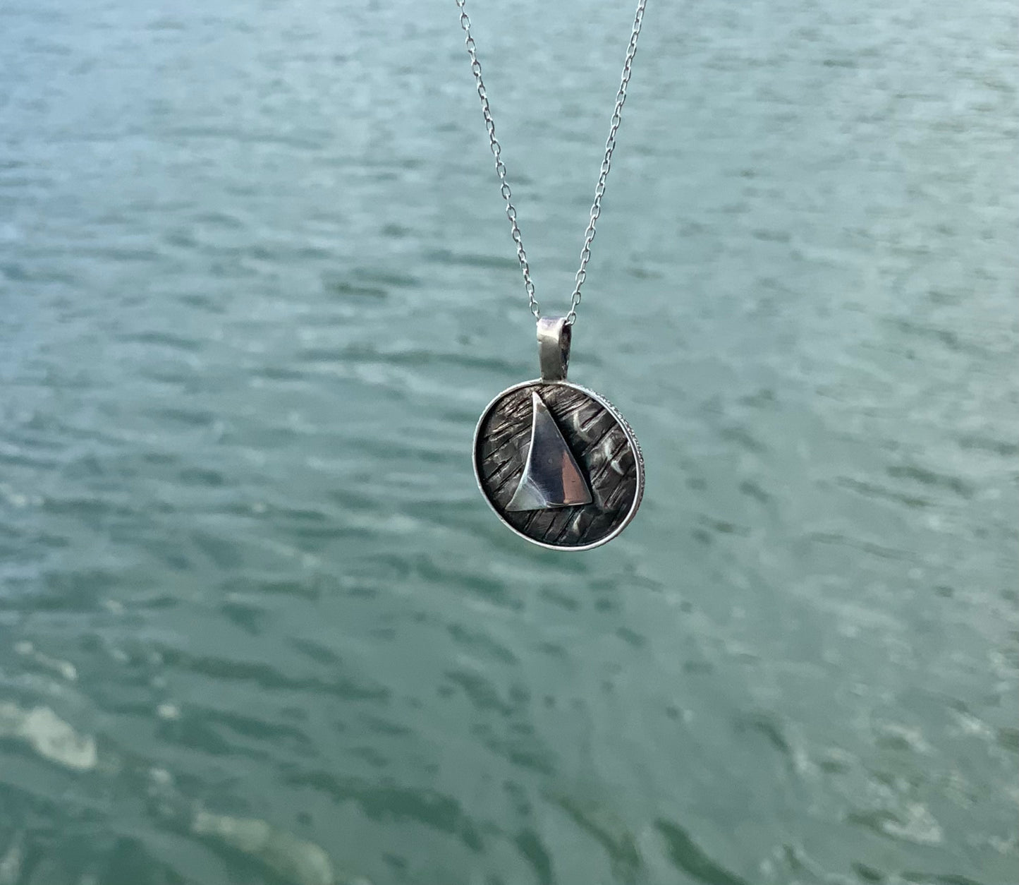 Round sail pendant Into the Wind