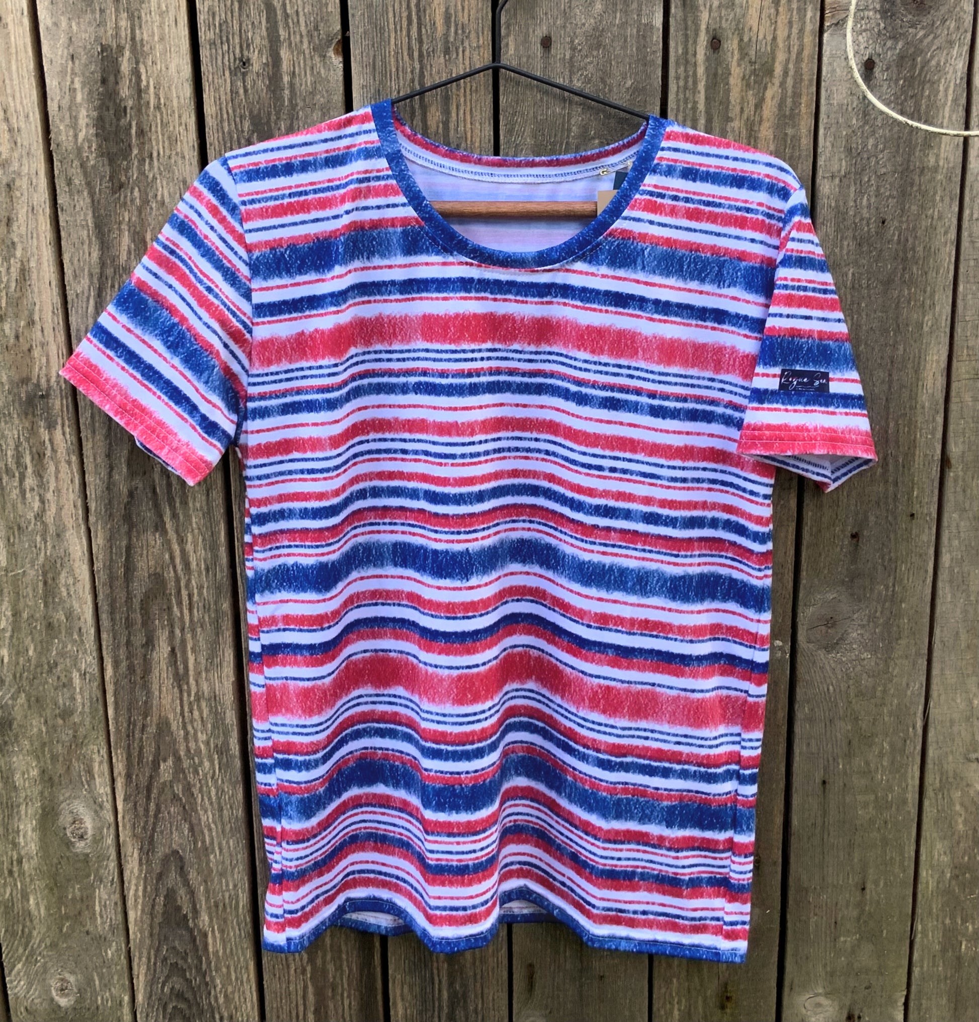 Marine Stripe t-shirt against boatshed