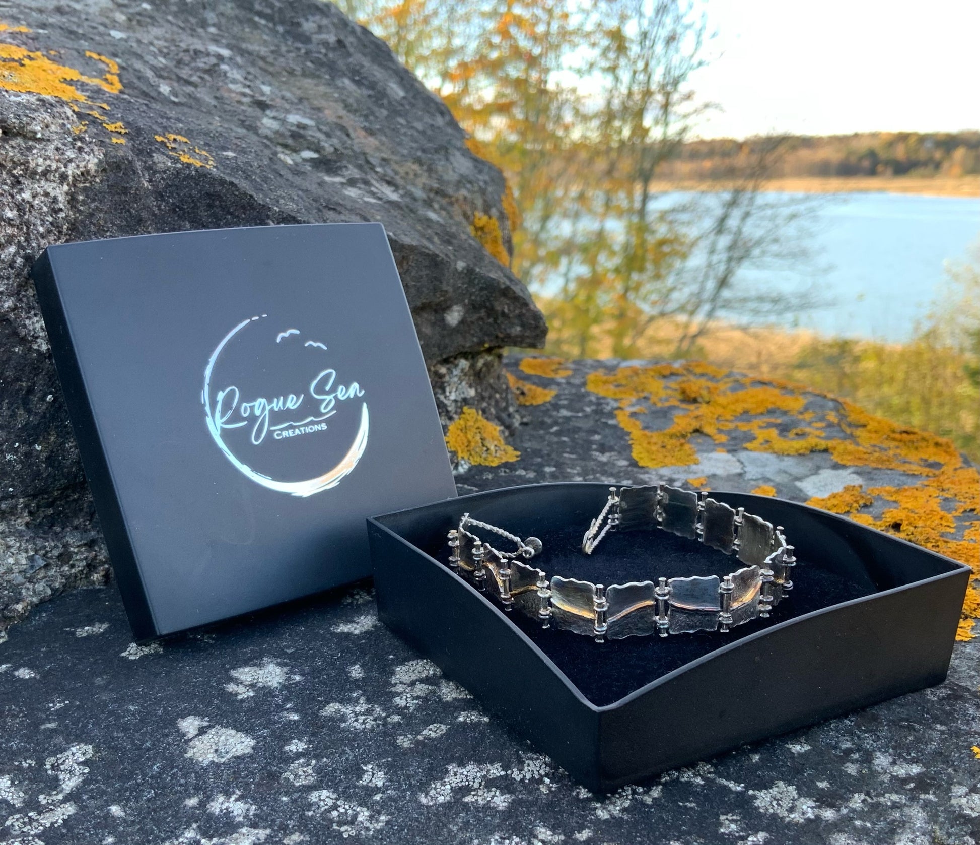 Geomwtric silver Bracelet in a black box with Rogue Sea Creations jewelry on a natural background