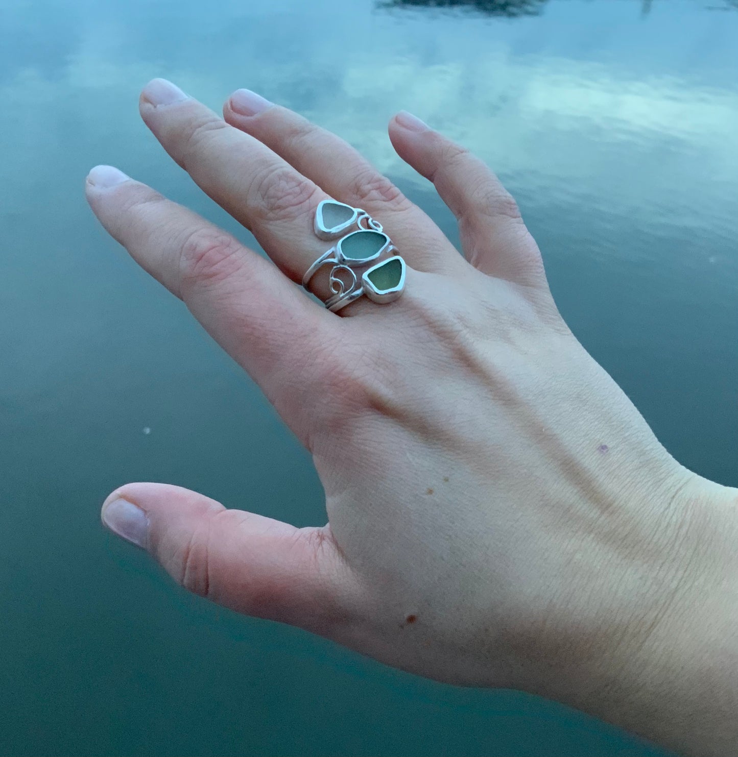 Seaside Fantasy handmade silver and sea glass ring in hand