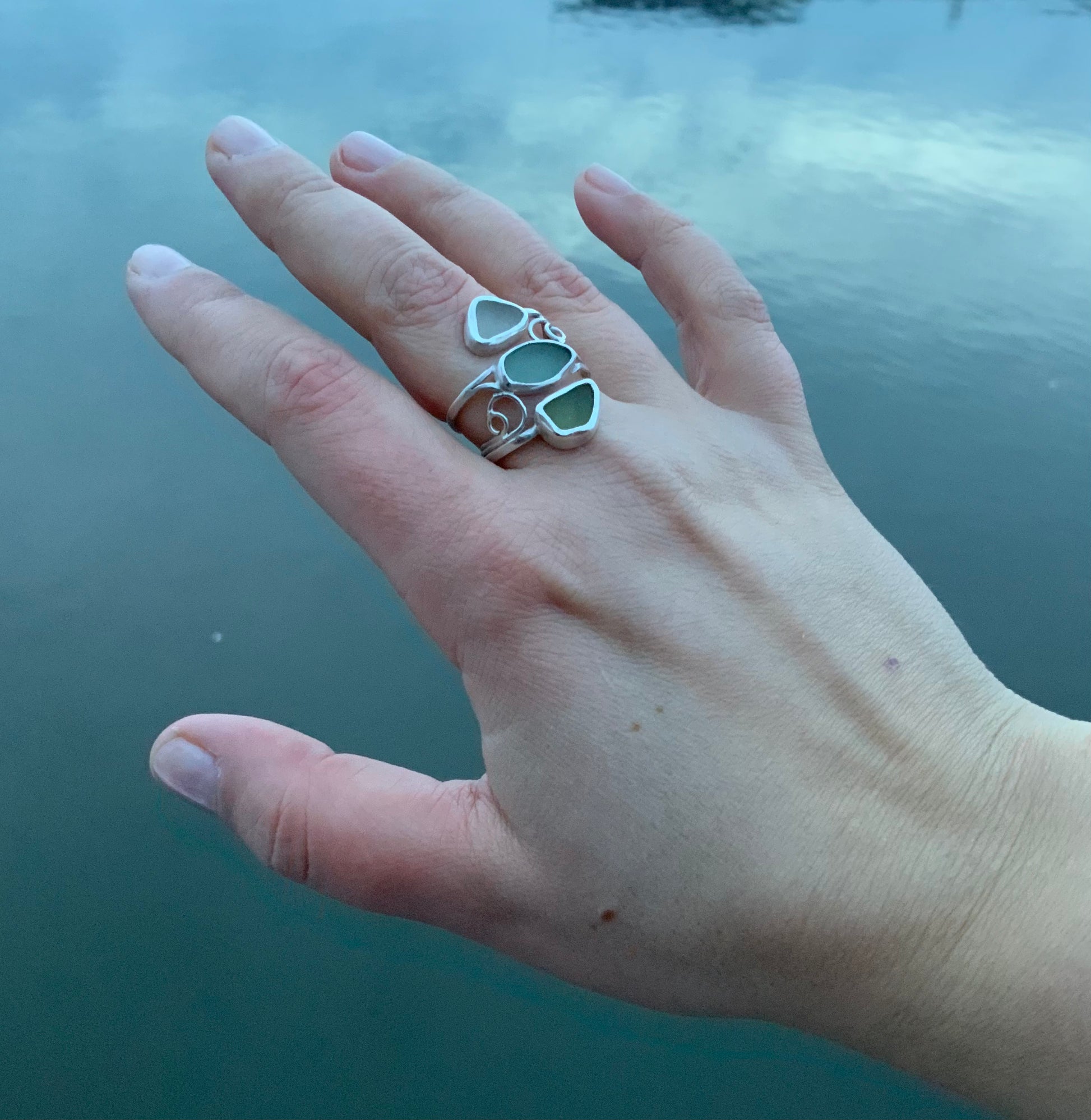 Seaside Fantasy handmade silver and sea glass ring in hand